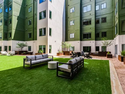 a view of a patio with a table and chairs