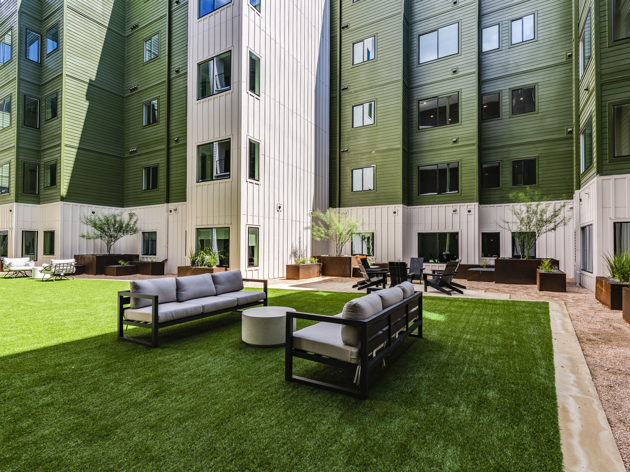 4802 South Congress Avenue, Unit 310 Austin, TX 78745 - Photo 19 of 37 community interior courtyard with turf and plenty of lounge space