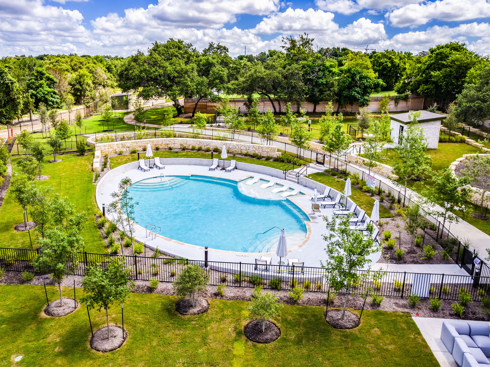 4802 South Congress Avenue, Unit 310 Austin, TX 78745 - Photo 2 of 37 Community pool with a patio area and view of the green space behind