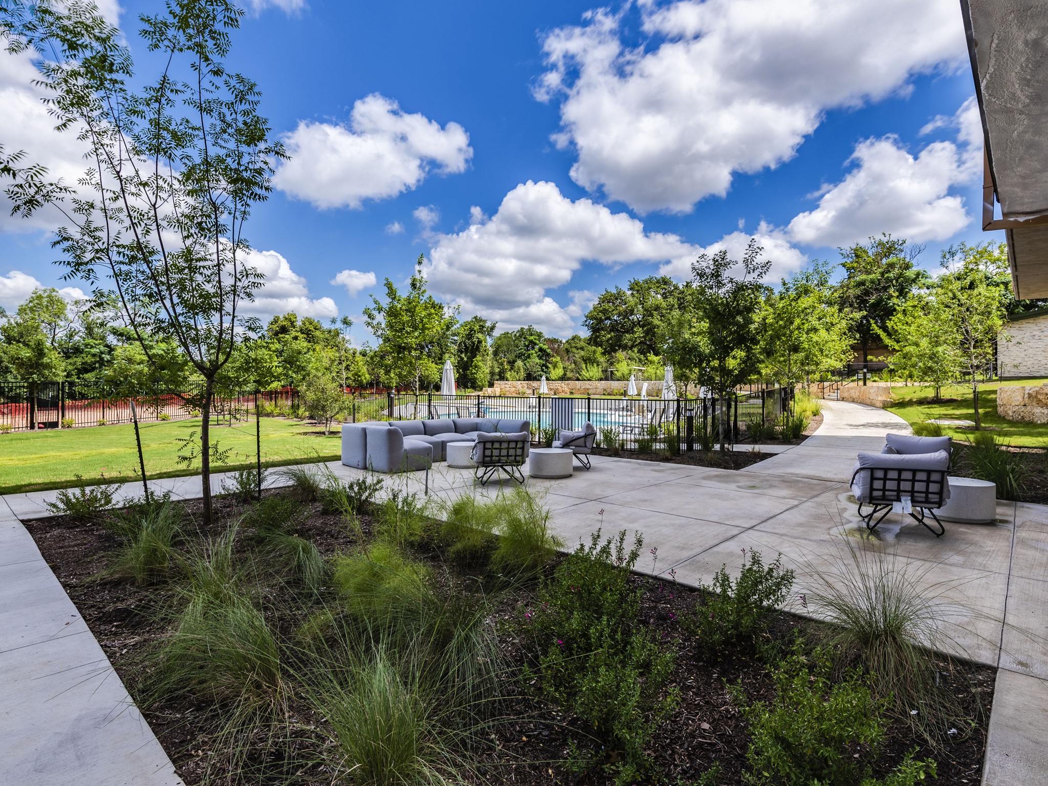 4802 South Congress Avenue, Unit 310 Austin, TX 78745 - Photo 22 of 37 Surrounding community featuring a patio, an outdoor hangout area, and a swimming pool