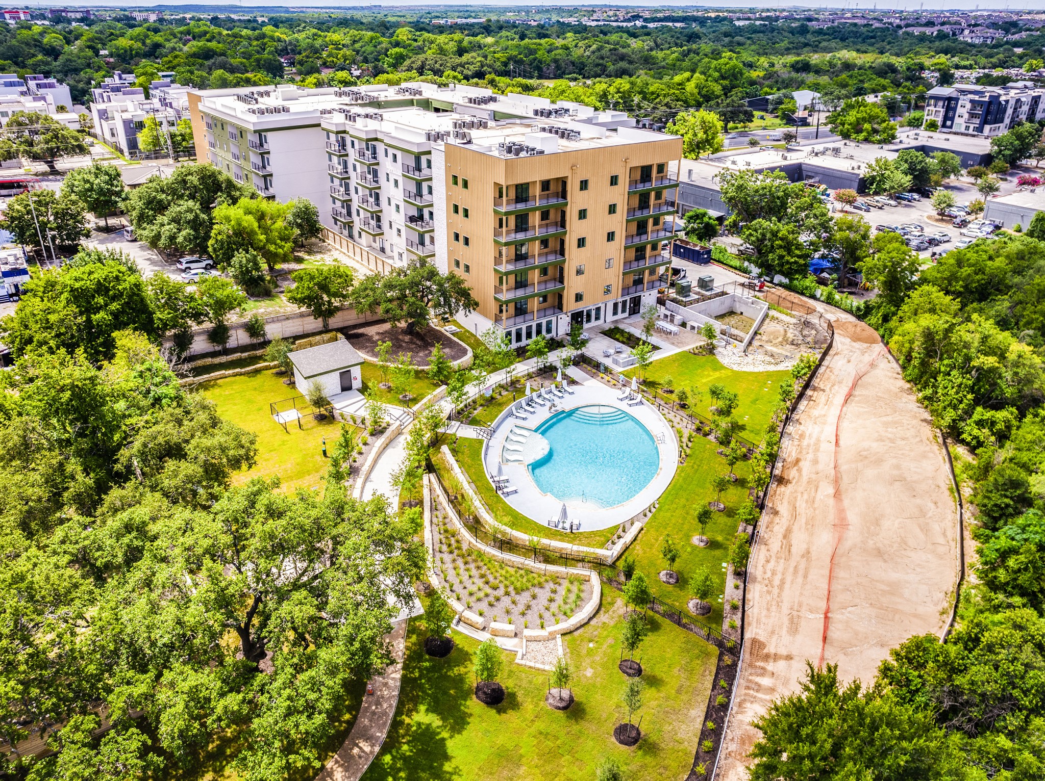4802 South Congress Avenue, Unit 310 Austin, TX 78745 - Photo 30 of 37 Drone / aerial view of the property and pool area
