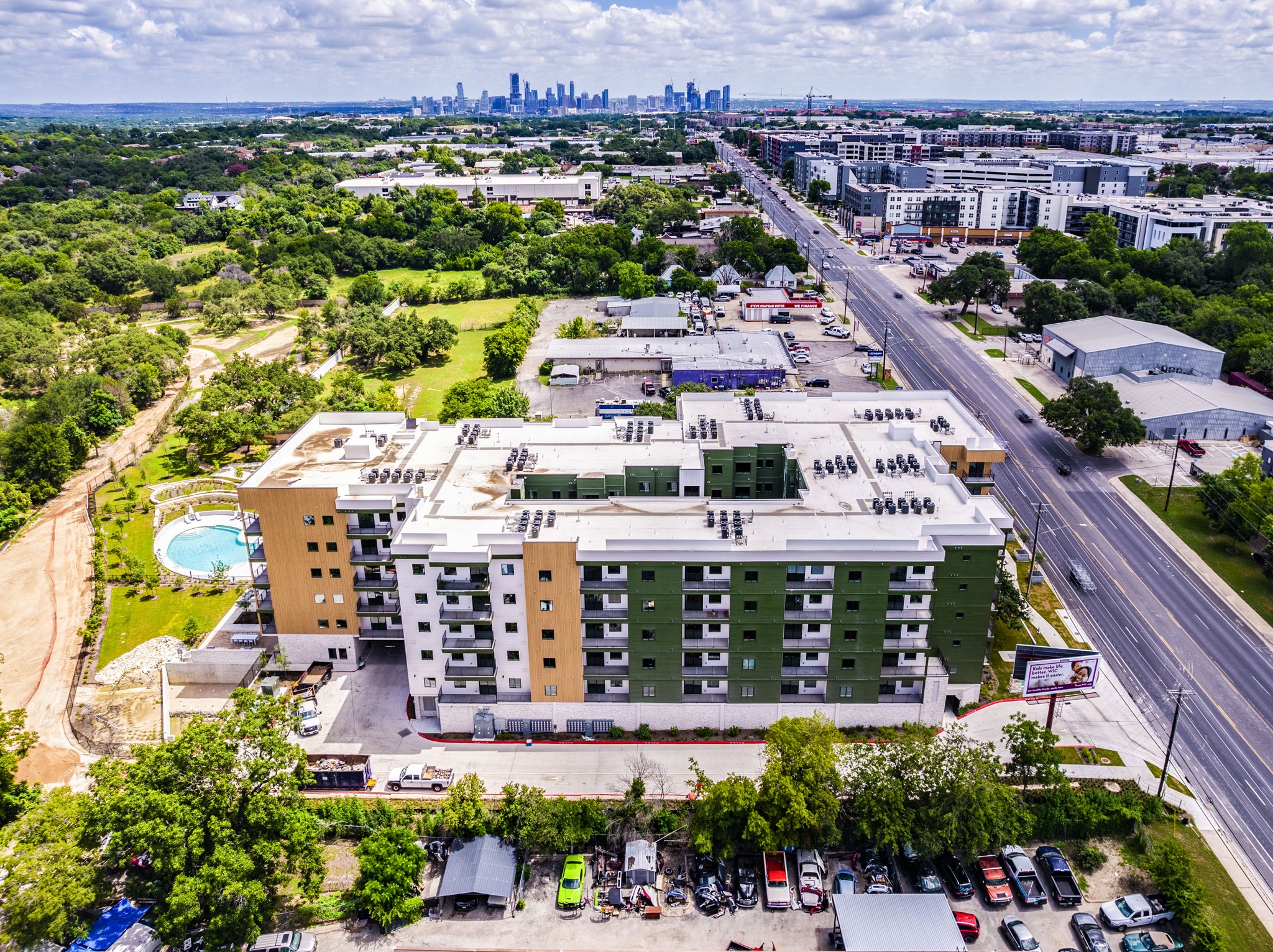 4802 South Congress Avenue, Unit 310 Austin, TX 78745 - Photo 31 of 37 Aerial view of the building and Austin skyline