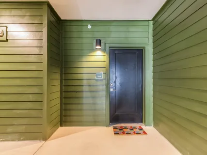 a kitchen with stainless steel appliances a refrigerator sink and microwave