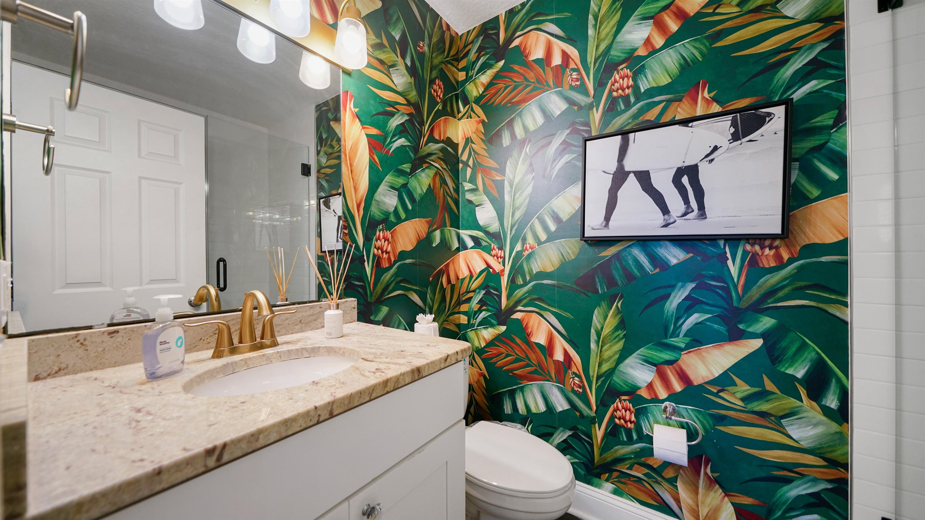108 A Street, Unit A St. Augustine, FL 32080 - Photo 18 of 38 a bathroom with a granite countertop sink and a mirror
