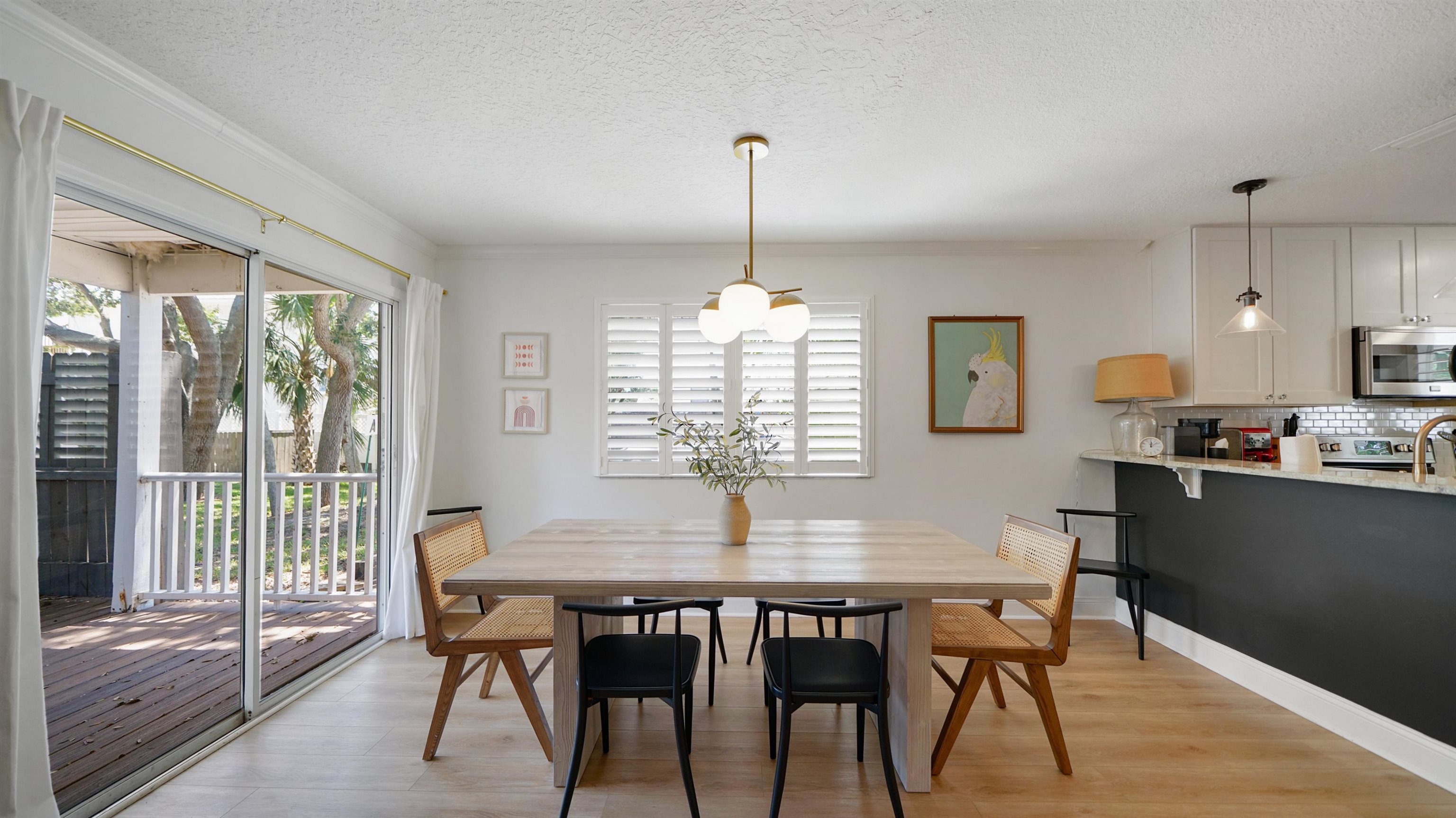 108 A Street, Unit A St. Augustine, FL 32080 - Photo 2 of 38 a dining room with furniture window and wooden floor