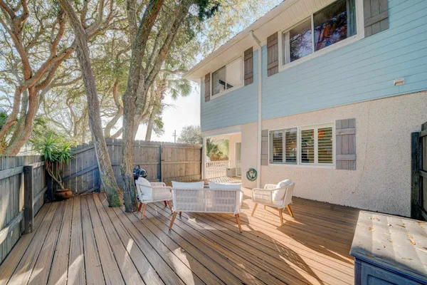 a view of a house with backyard porch and sitting area