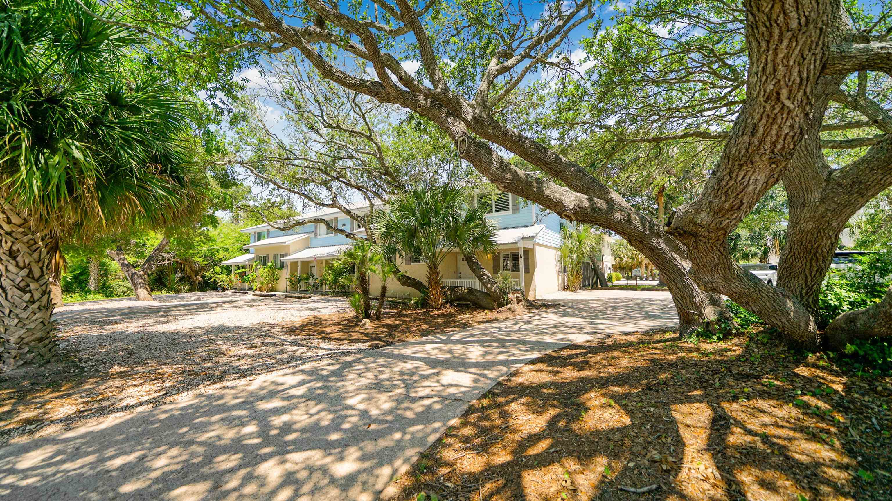 108 A Street, Unit A St. Augustine, FL 32080 - Photo 31 of 38 a view of a yard with plants and trees
