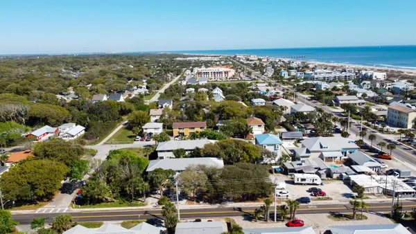 an aerial view of residential building and parking space