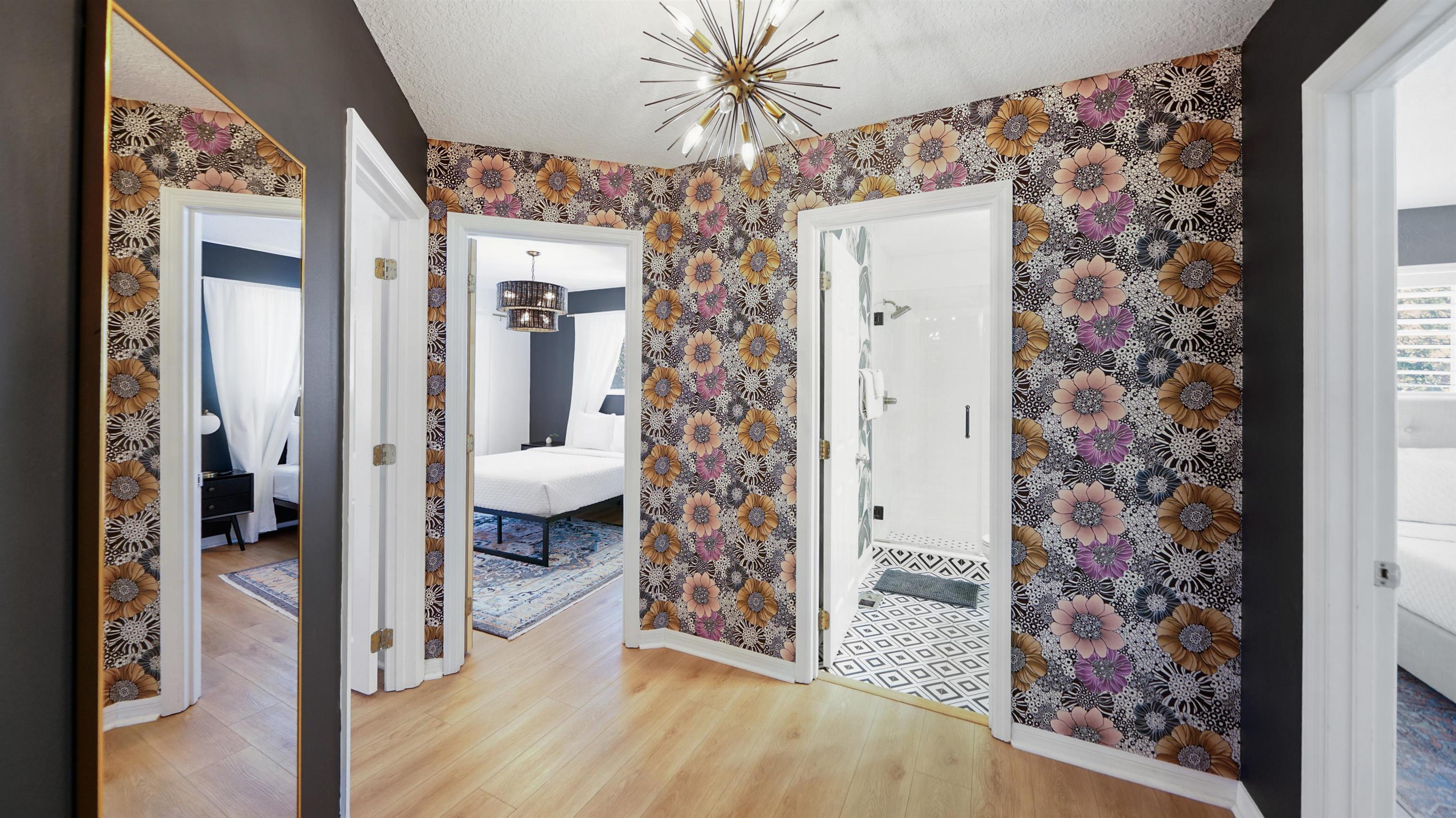 108 A Street, Unit A St. Augustine, FL 32080 - Photo 5 of 38 a view of a hallway with bathroom and wooden floor