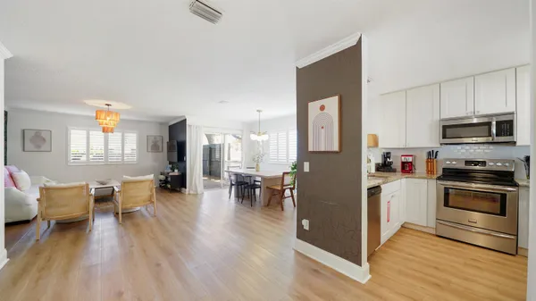 a kitchen with a table and chairs in it