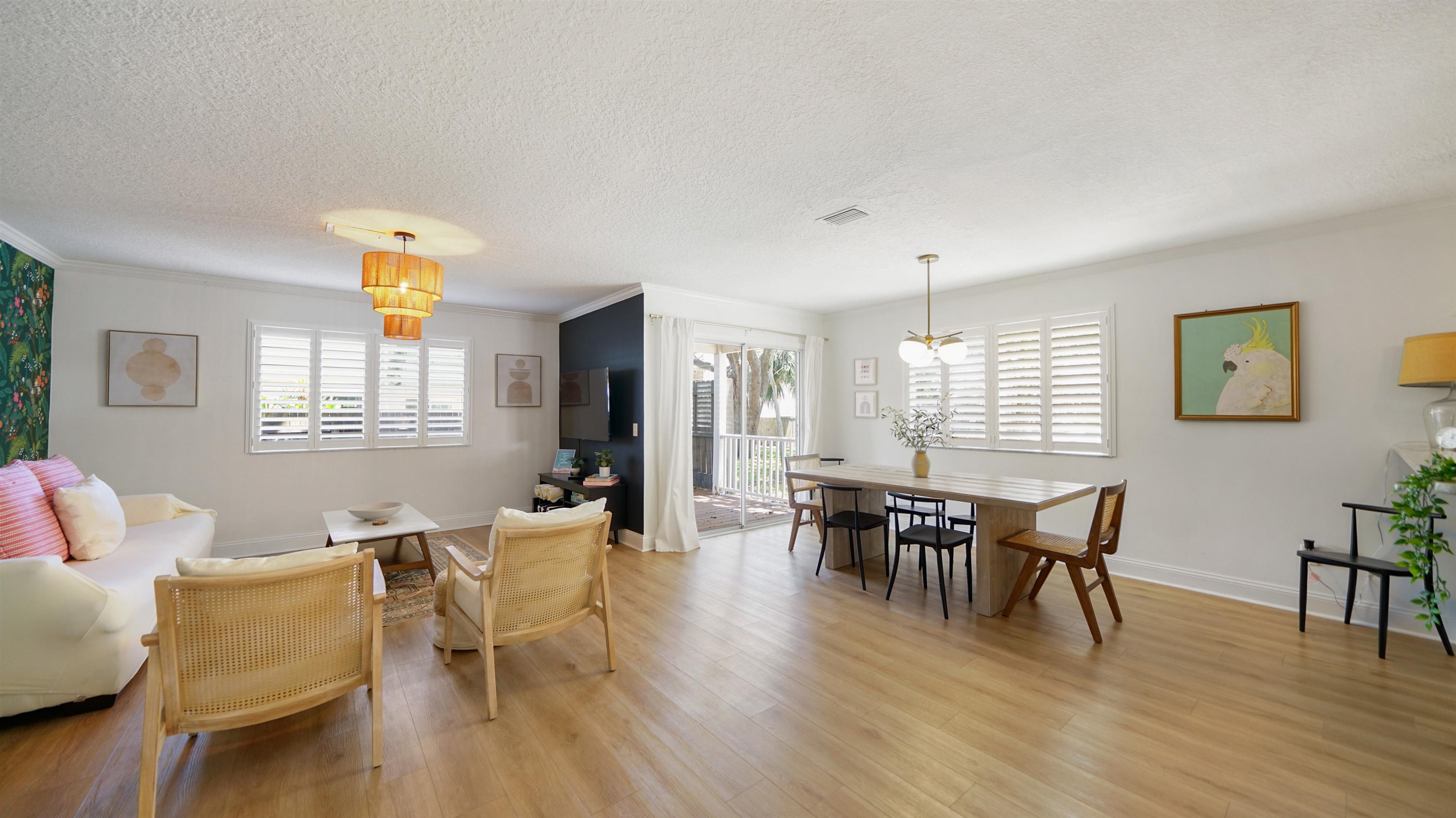 108 A Street, Unit A St. Augustine, FL 32080 - Photo 7 of 38 a view of a dining room with furniture window and wooden floor