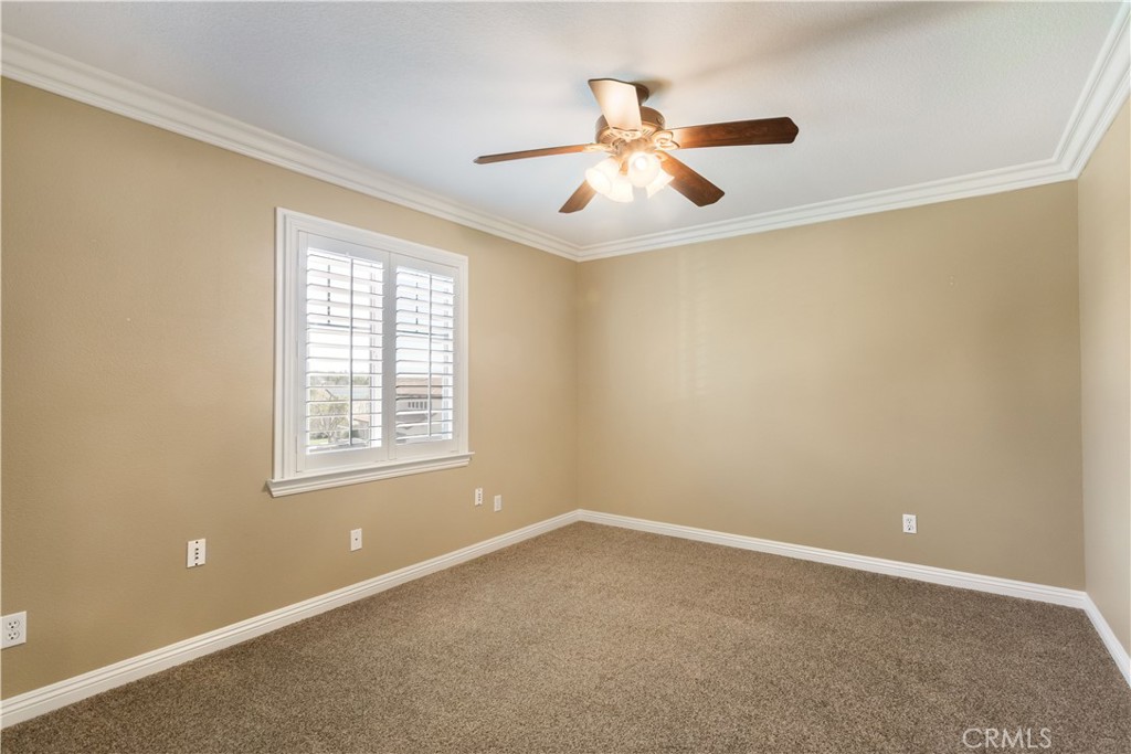 33351 Nicholas Common Temecula, CA 92592 - Photo 26 of 42 a view of an empty room with chandelier fan and a window