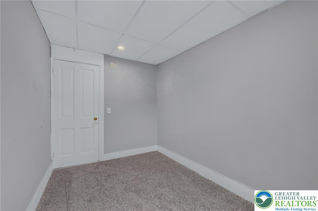 313 Main Street Slatington, PA 18080 - Photo 50 of 73 A compact room featuring neutral carpet and a crisp white door, ready for personalization.