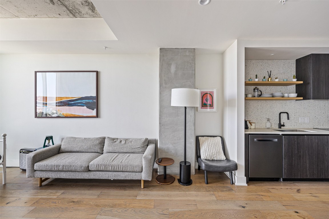 48 East Avenue, Unit 2405 Austin, TX 78701 - Photo 11 of 40 a living room with furniture and a lamp