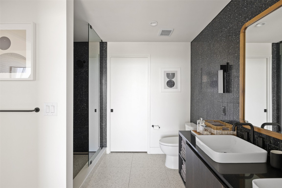 48 East Avenue, Unit 2405 Austin, TX 78701 - Photo 20 of 40 a bathroom with a sink and a mirror
