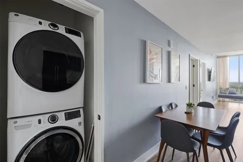 a view of a hallway with washer and dryer