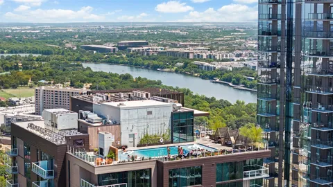 an aerial view of a house with a garden and outdoor seating