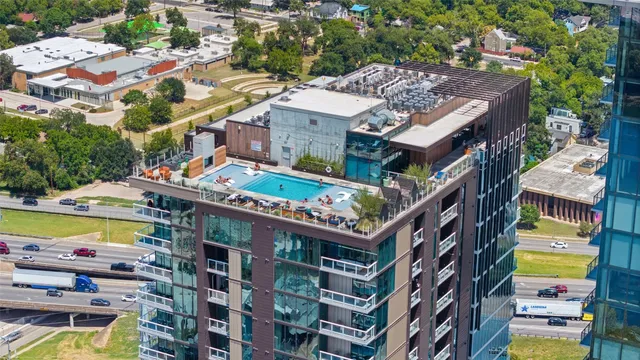 a front view of a multi story building with yard