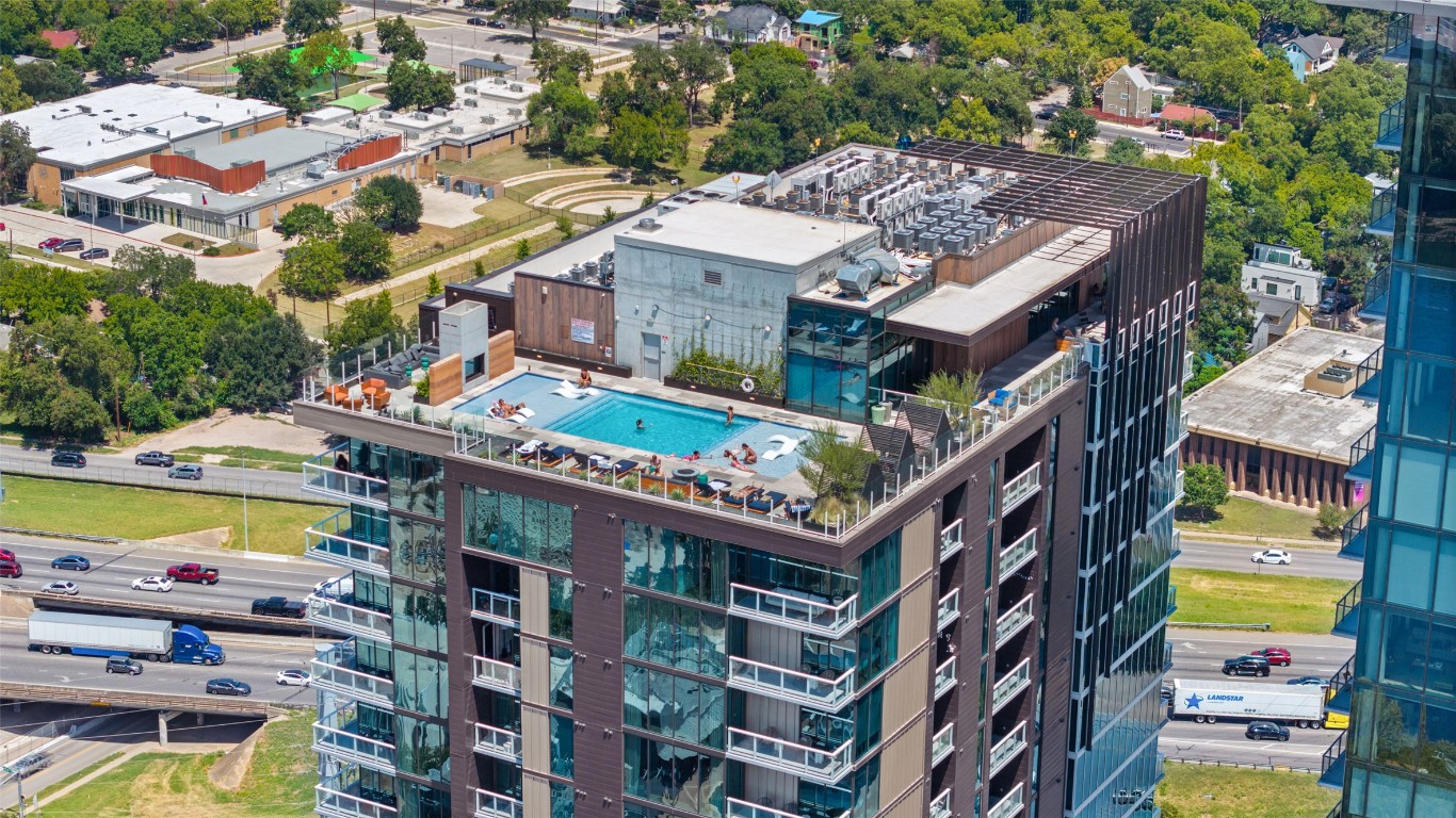 48 East Avenue, Unit 2405 Austin, TX 78701 - Photo 26 of 40 a front view of a multi story building with yard