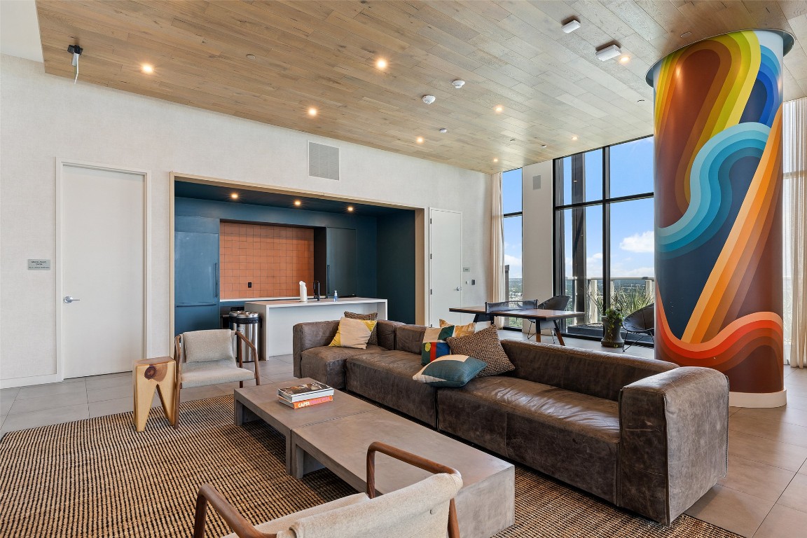 48 East Avenue, Unit 2405 Austin, TX 78701 - Photo 29 of 40 a living room with furniture and a potted plant