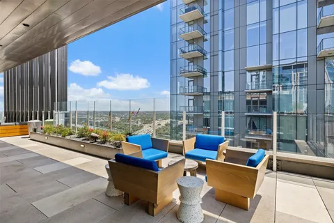 a blue chair sitting in front of a building