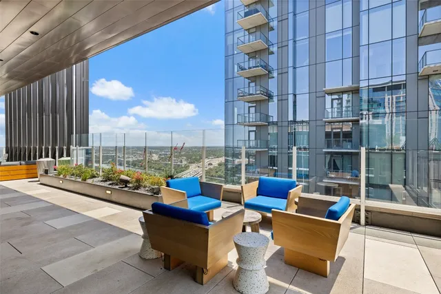 a blue chair sitting in front of a building