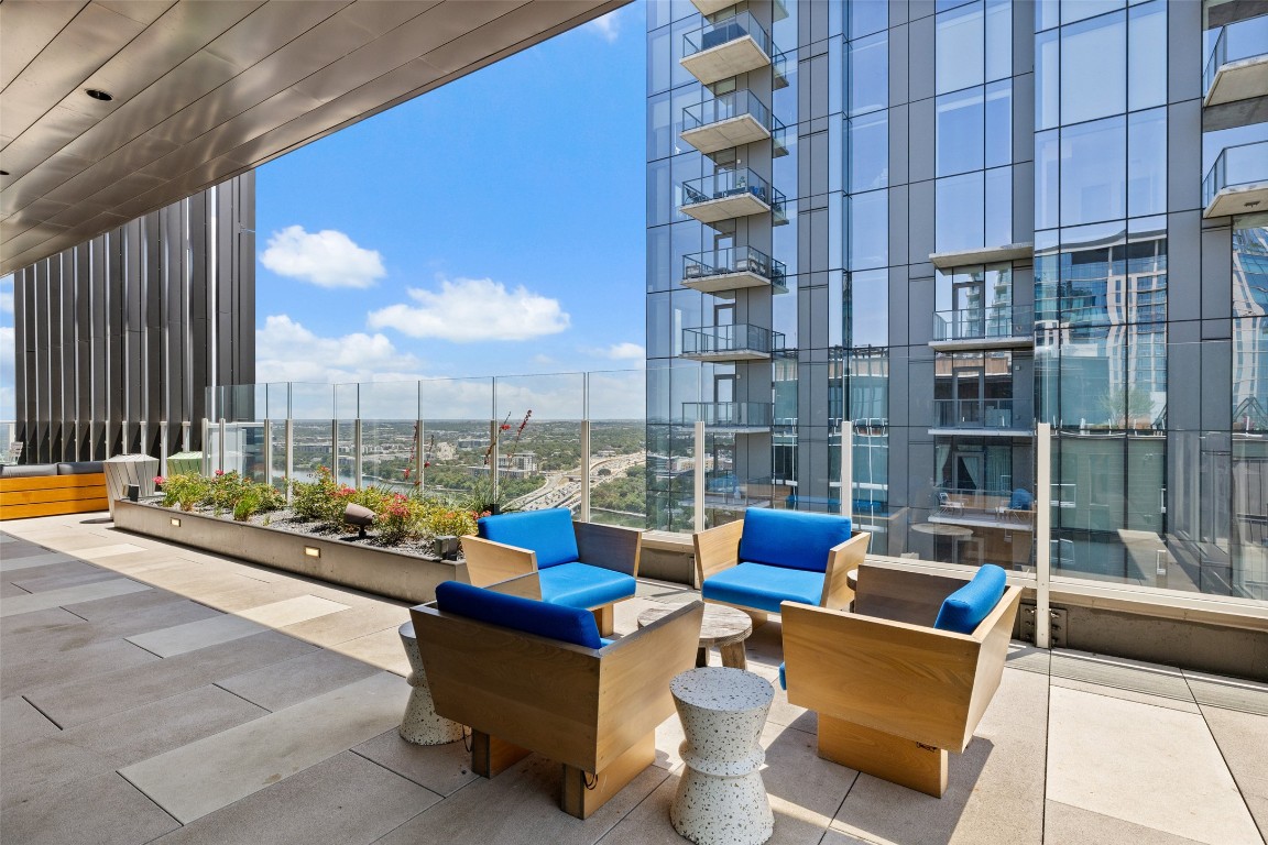 48 East Avenue, Unit 2405 Austin, TX 78701 - Photo 35 of 40 a blue chair sitting in front of a building