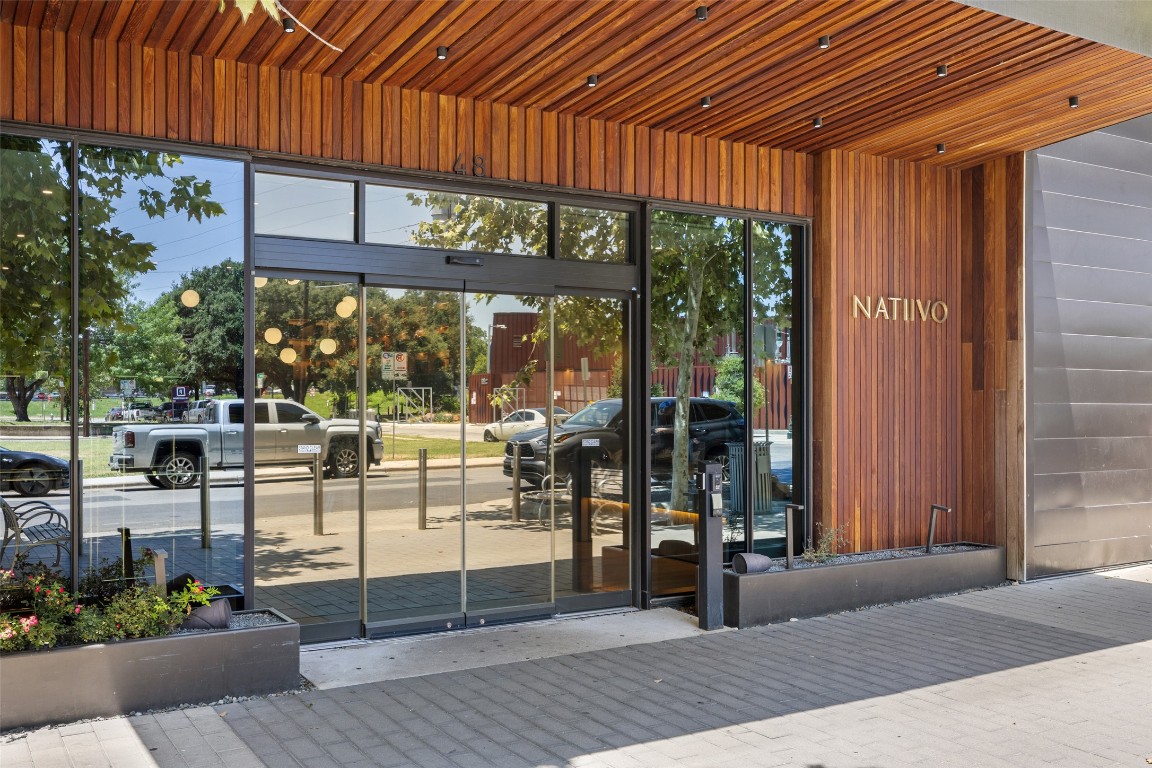 48 East Avenue, Unit 2405 Austin, TX 78701 - Photo 37 of 40 a view of a patio with a table and chairs