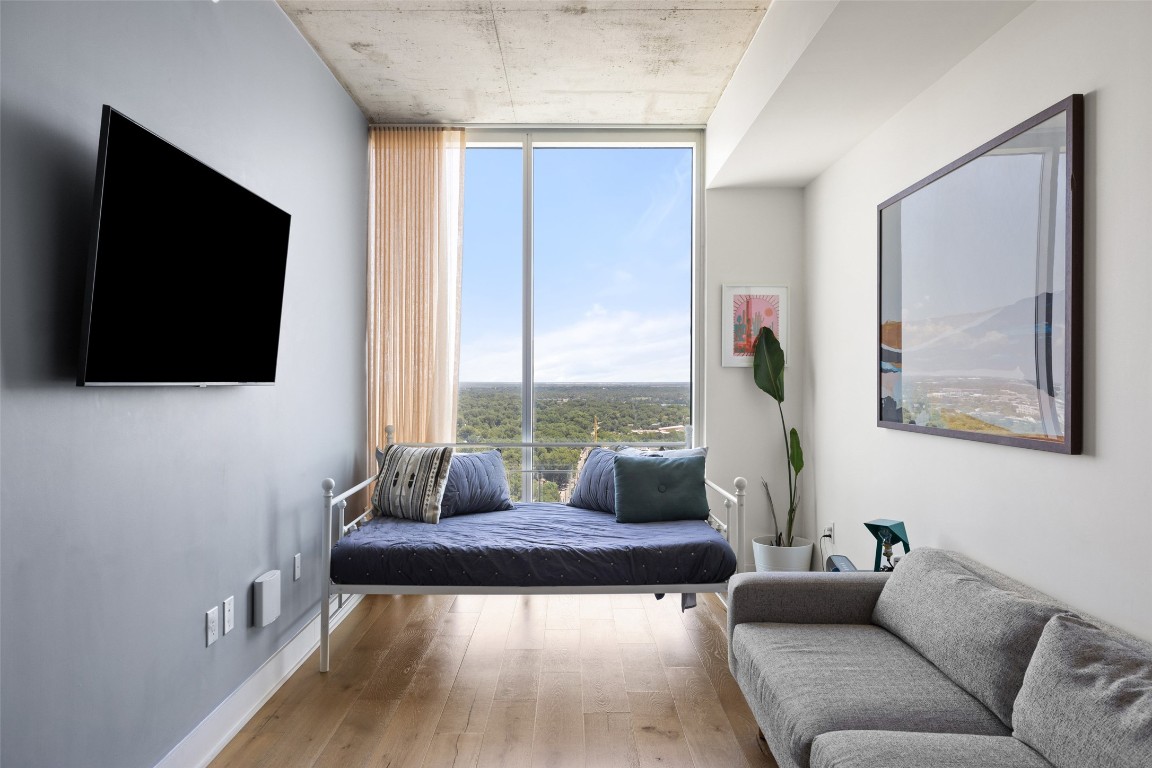 48 East Avenue, Unit 2405 Austin, TX 78701 - Photo 9 of 40 a living room with furniture and a flat screen tv
