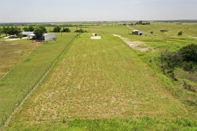 a car parked in the ocean next to a lake