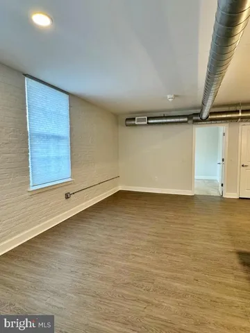 an empty room with a empty space and window