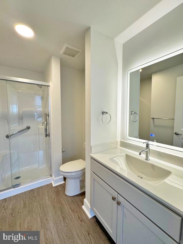 50 North Duke Street, Unit 305 York, PA 17401 - Photo 10 of 10 a bathroom with a sink a toilet a shower and a mirror