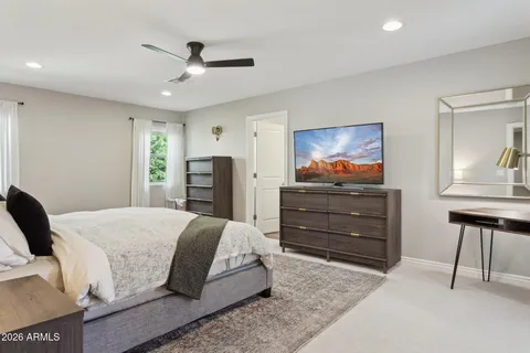 a living room with a bed and furniture