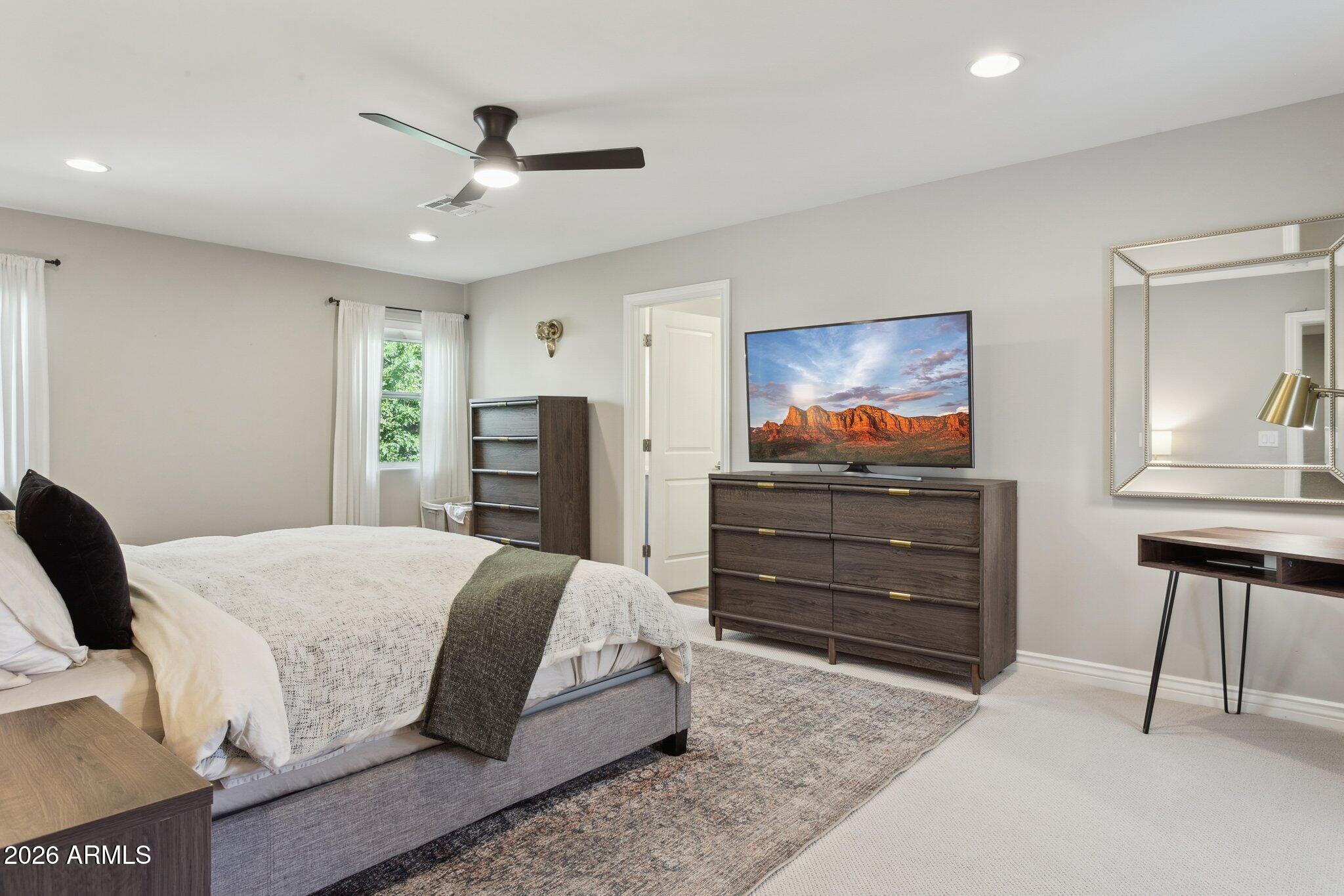 3021 North 47th Place Phoenix, AZ 85018 - Photo 11 of 33 a living room with a bed and furniture