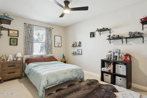 a bedroom with a bed and dresser