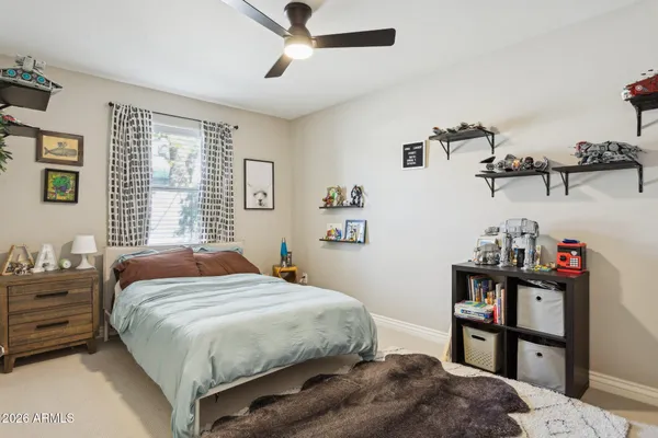a bedroom with a bed and dresser