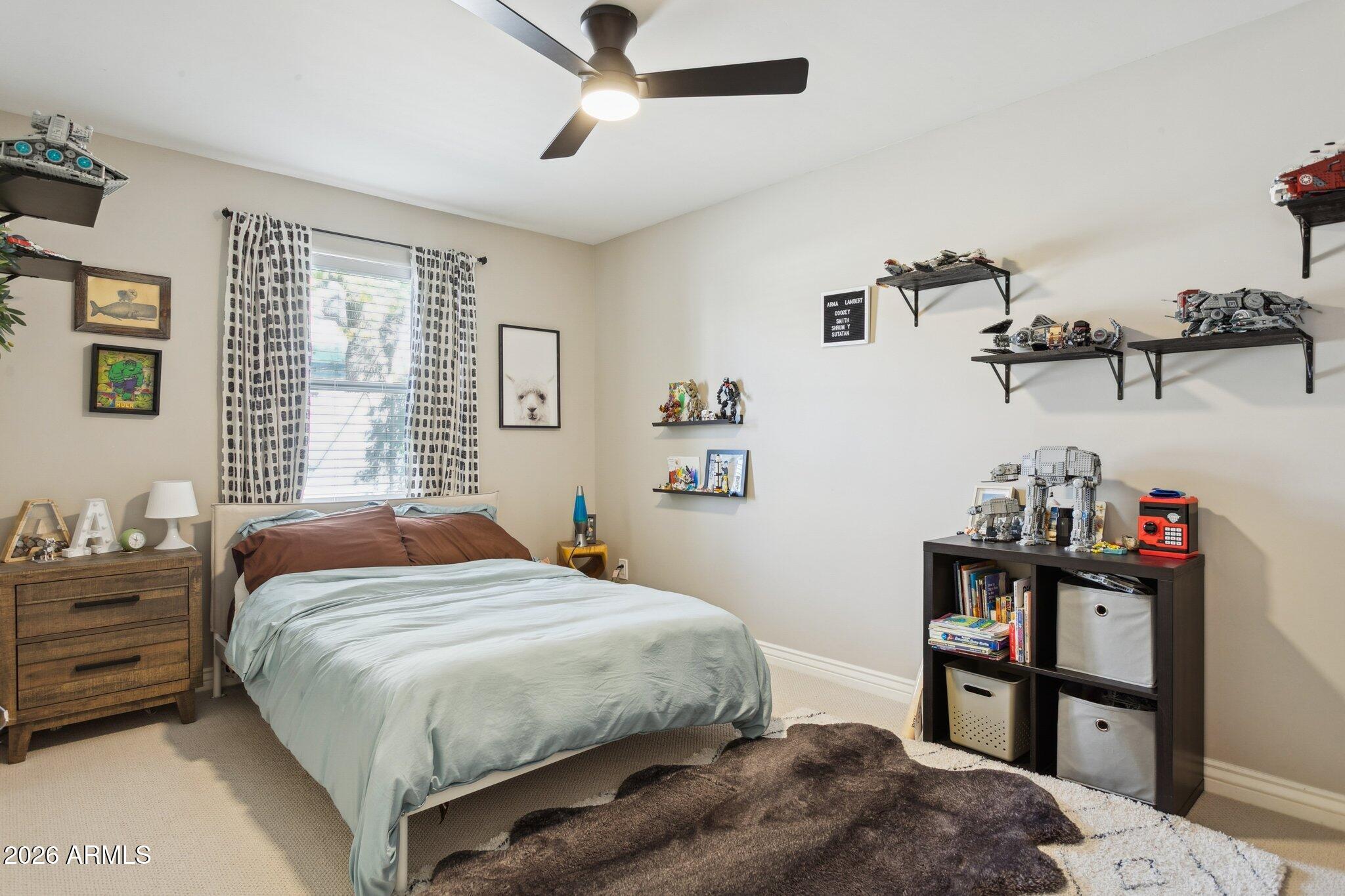 3021 North 47th Place Phoenix, AZ 85018 - Photo 20 of 33 a bedroom with a bed and dresser