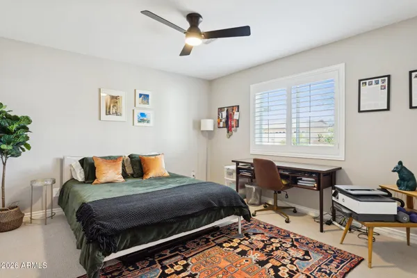 a bedroom with a bed and a table