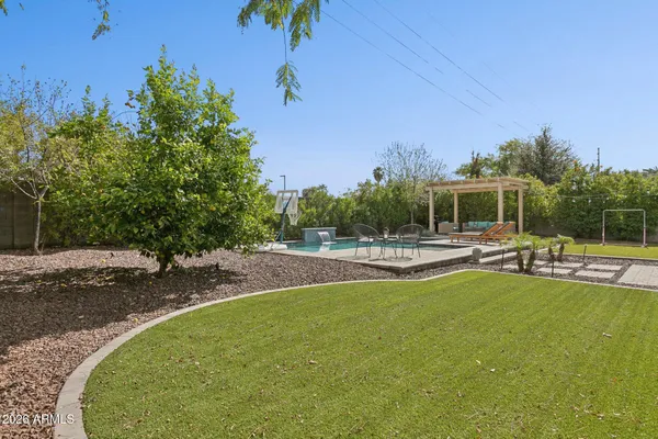 a view of a swimming pool with outdoor seating