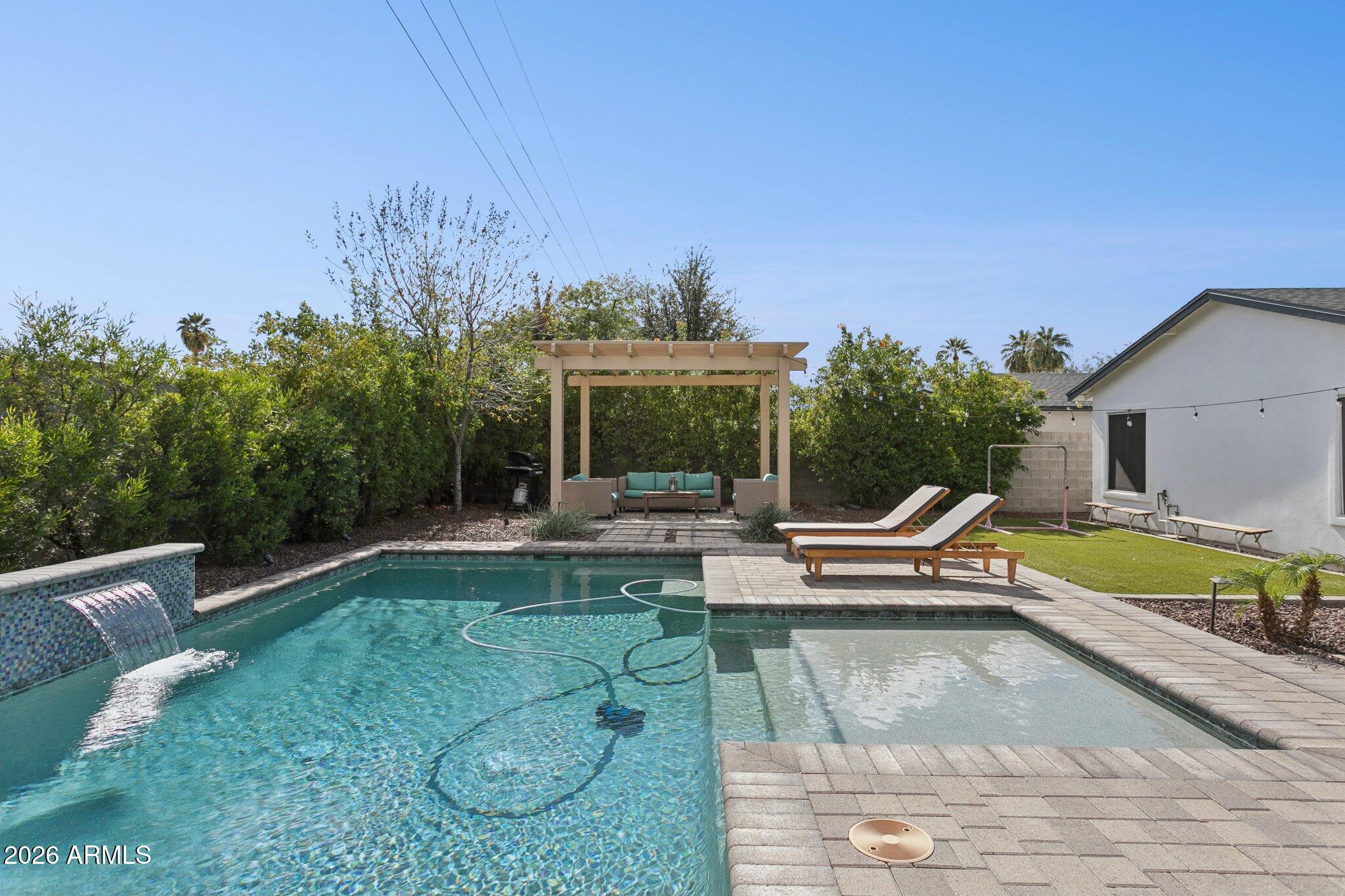 3021 North 47th Place Phoenix, AZ 85018 - Photo 29 of 33 a view of a swimming pool with a patio