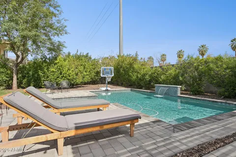 a view of a backyard with sitting area