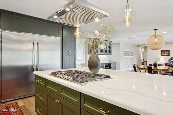 a kitchen with a refrigerator and countertop
