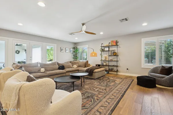 a living room with furniture or couch and a large window