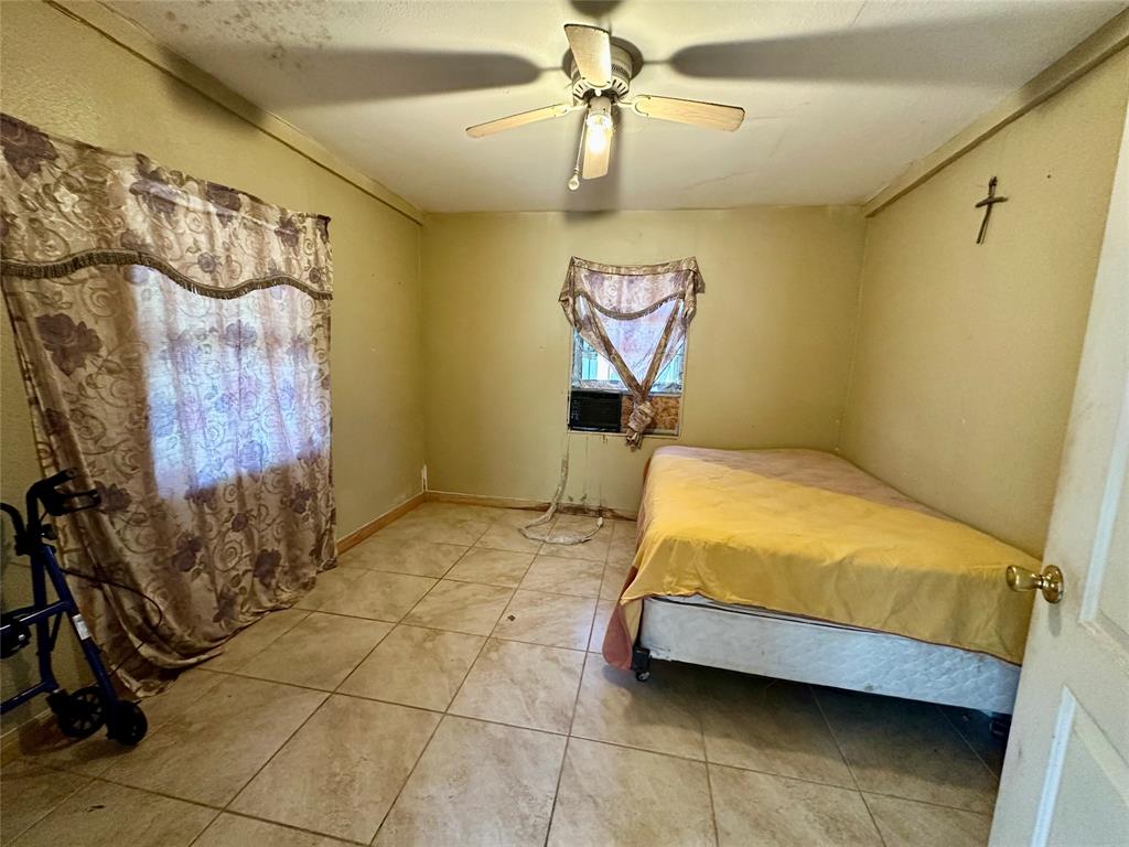 1314 Old Country Road Moody, TX 76557 - Photo 5 of 12 a bed sitting in a room next to a window and a chandelier