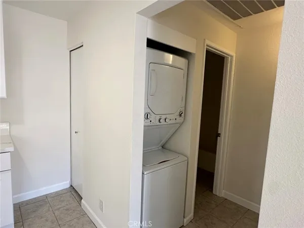 a bathroom with a toilet and a mirror