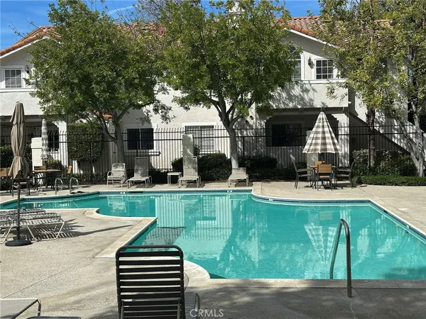 a front view of house with yard and seating area