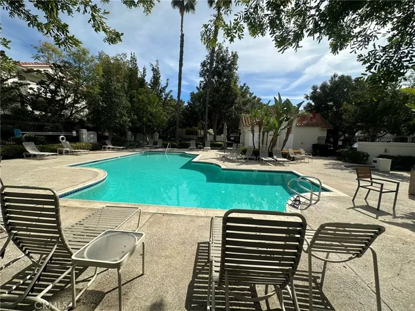 a view of a swimming pool with a patio