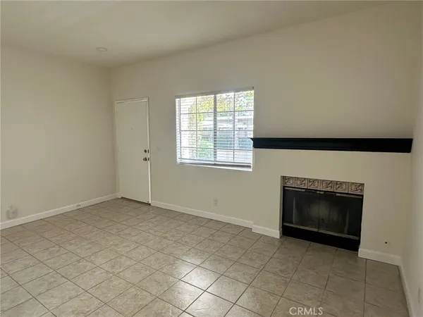 an empty room with a fireplace