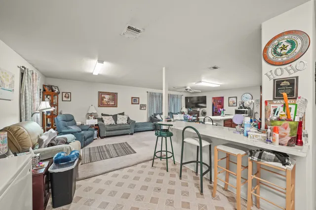 a living room with furniture and a table