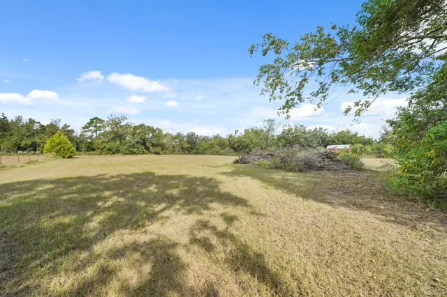a view of lake with green space